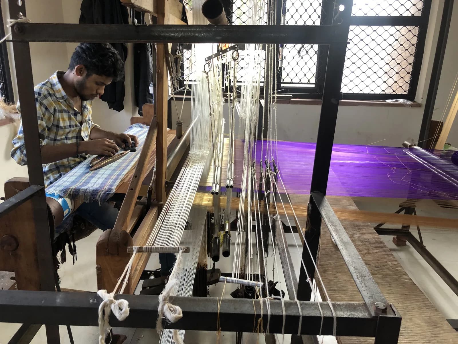 A weaver working a handloom Chanderi saree