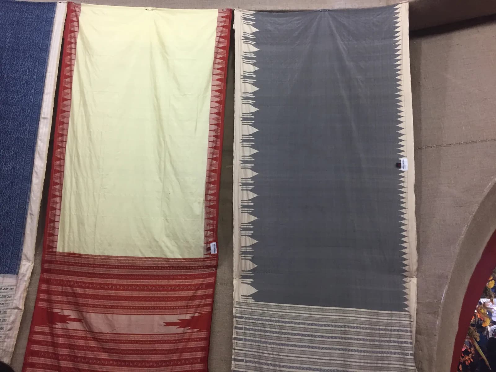 Tussar silk sarees on display, showing the fabric's natural gold-brown colour