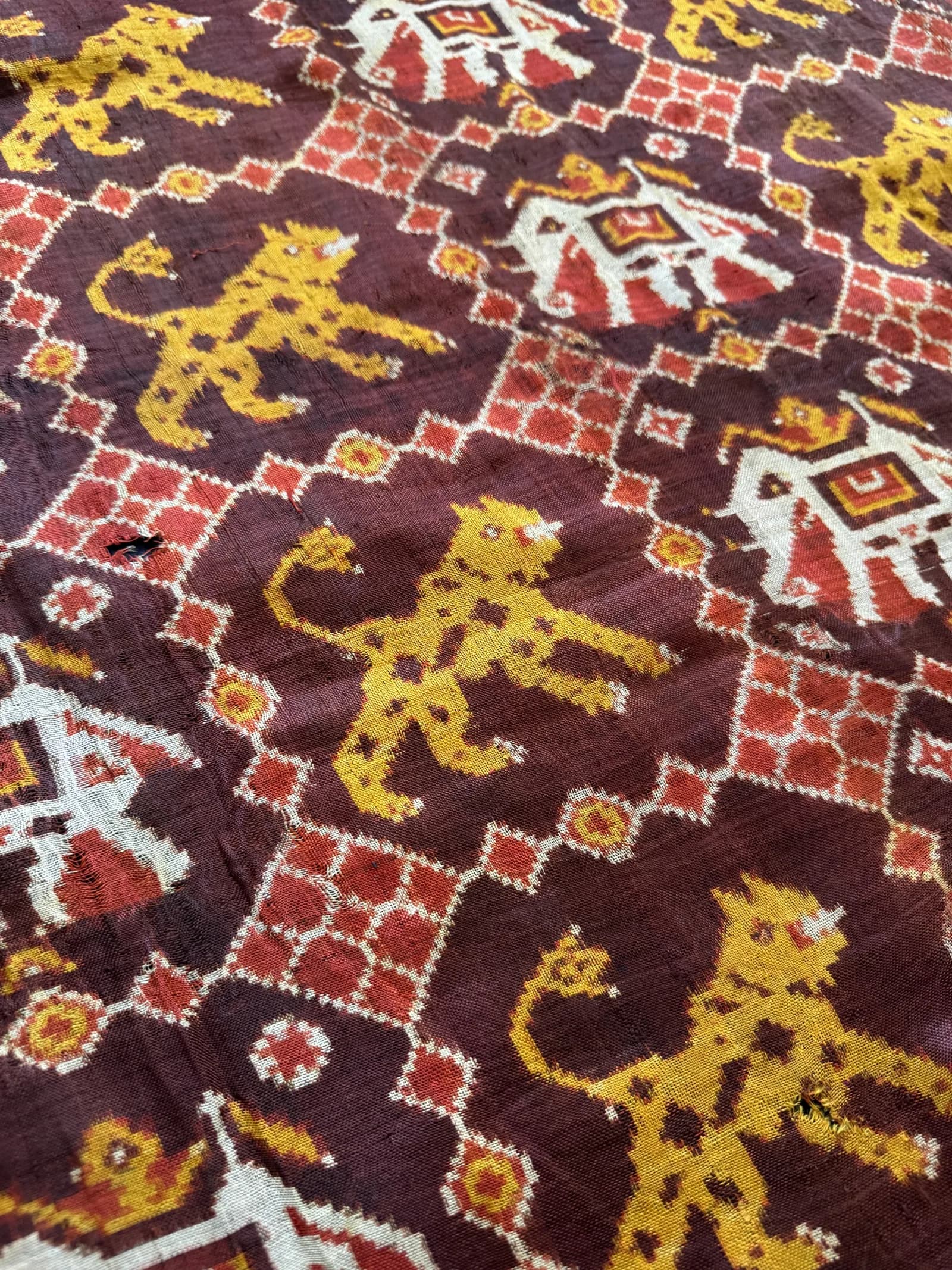 Detail of an antique Patan Patola double ikat textile, showing the geometric pattern woven into the thread